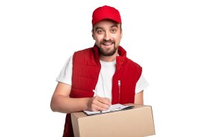 Cheerful delivery man writing on clipboard